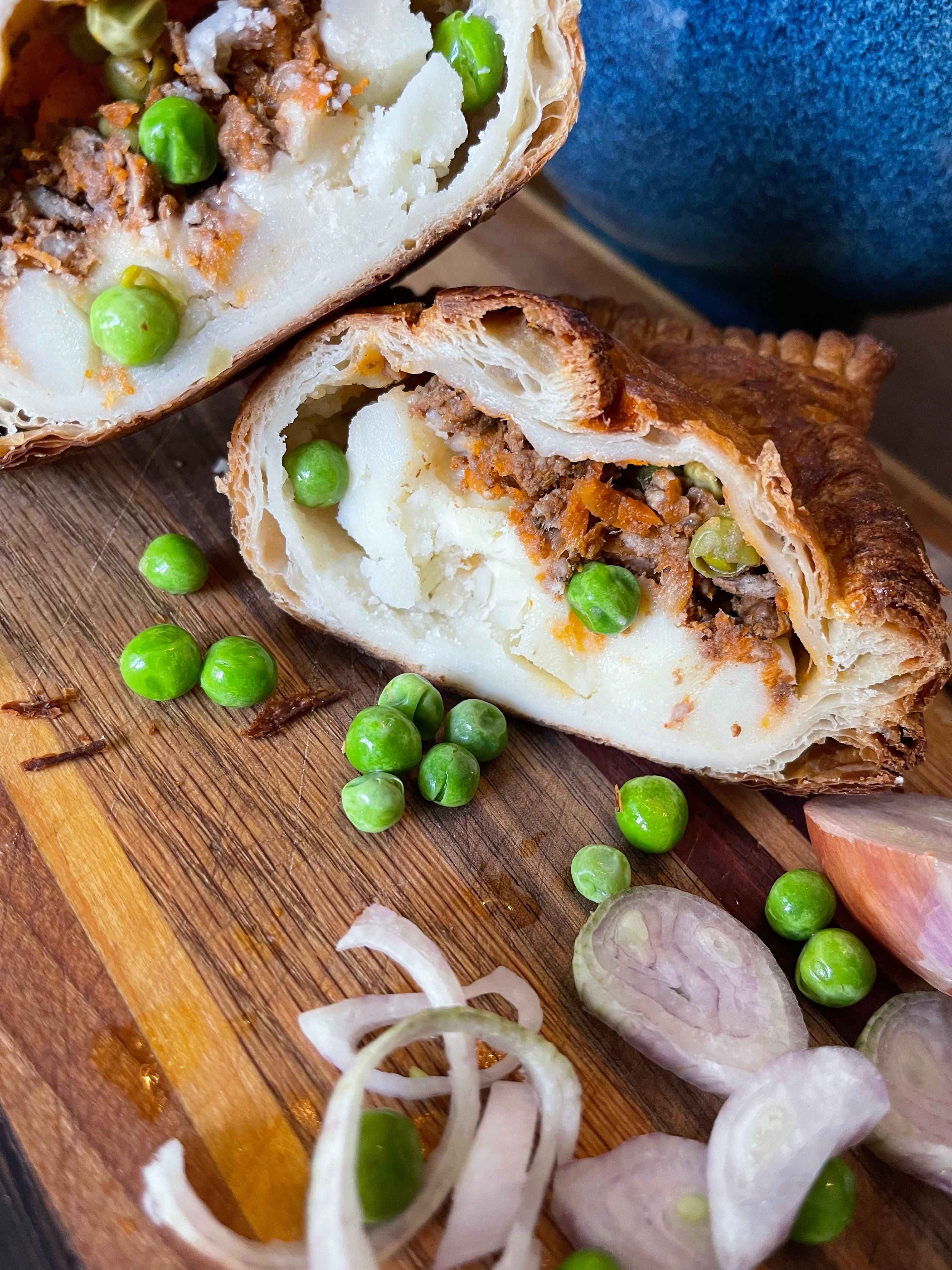 A close up of a samosa flavored hand pie